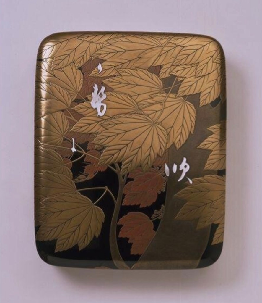 Writing box decorated with a maple tree blowing in the wind and Chinese characters, in gold, red and black lacquer and inlaid with mother-of-pearl, signed ‘Taisai’ and marked ‘Koma’, Japan, 1900-15